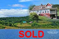 Majestic Farmhouse overlooking the Bras d`Or Lakes on up to 167 acres land and 620 m waterfront for sale on Cape Breton Nova Scotia