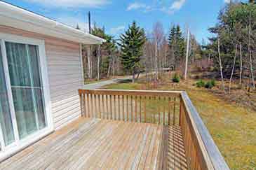 Bras d’Or Beach House for sale in Little Narrows, Cape Breton, Nova Scotia, with extra apartment and garage